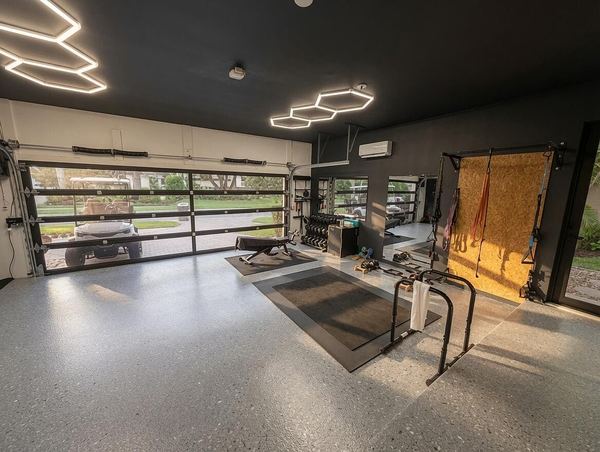 Garage gym and storage cabinetry with the glass garage door