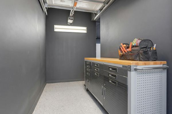 Garage bay with a stainless workbench and tool storage