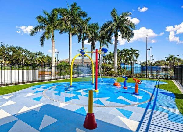 Community splash pad with palm trees