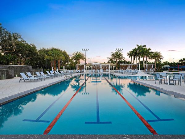 Club resort-style lap pool at dusk